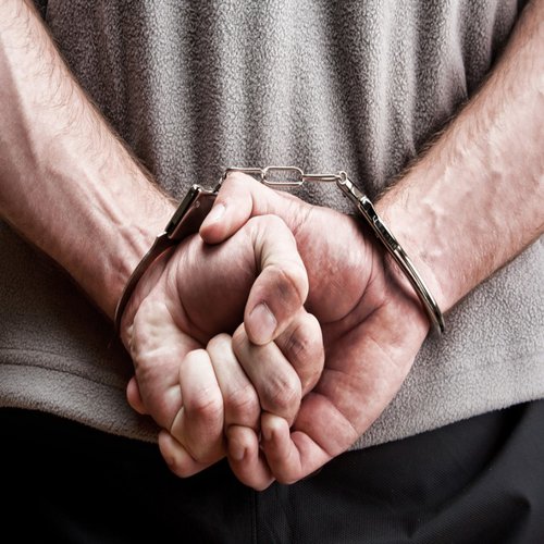 bigstock-Criminal-In-Handcuffs-14611325_converted